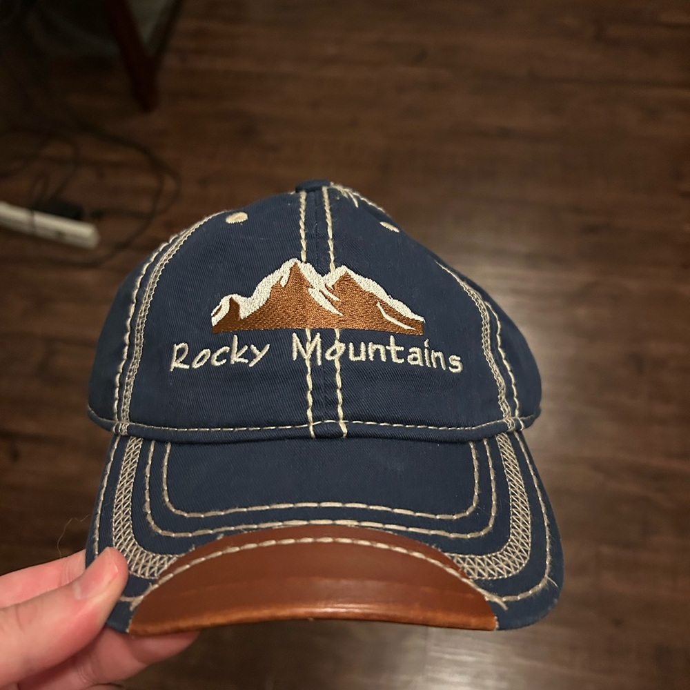 Rocky Mountains Blue Cap with Brown Brim. Adjustable